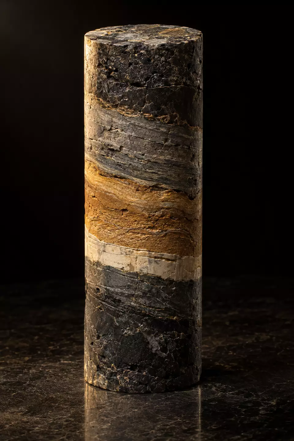 A drilled rock core showing its layers